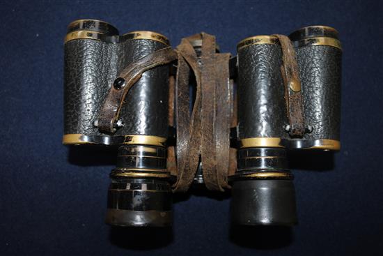 A pair of German WWI binoculars, two helmet straps and four pairs of Africa core goggles